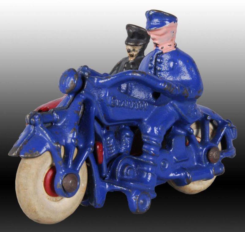 Appraisal: Cast Iron Champion Motorcycle Toy with Photograph Description Motorcycle has