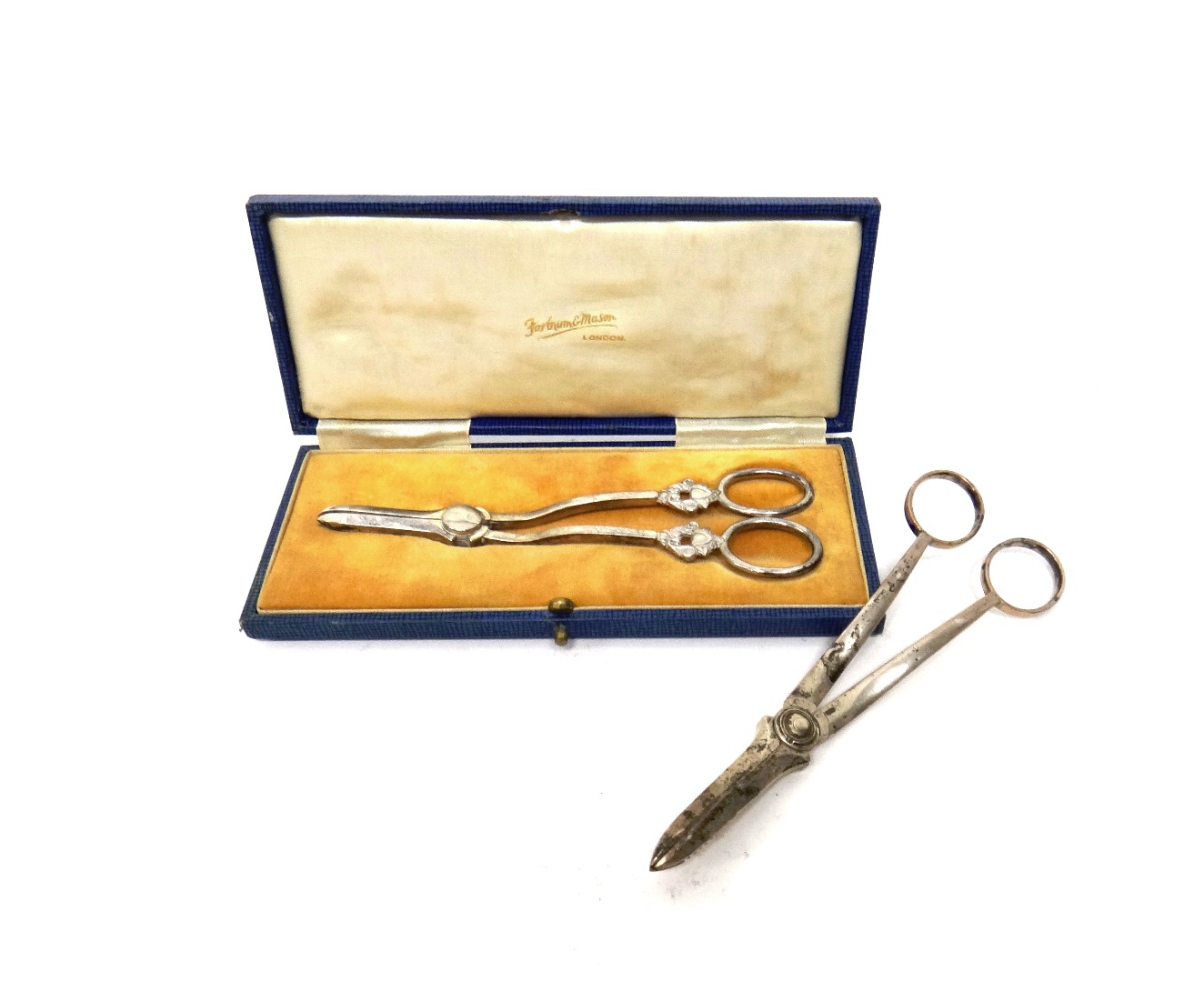 Appraisal: A pair of silver grape scissors Sheffield in a Fortnum