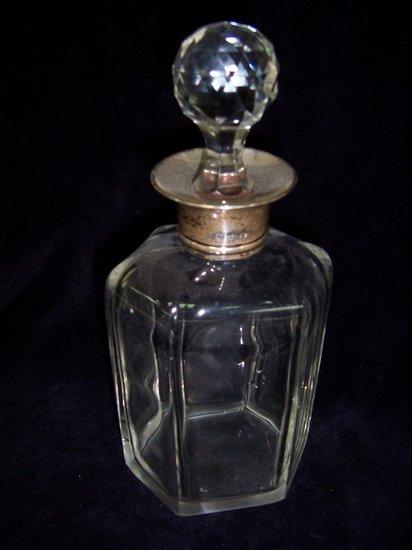 Appraisal: A silver mounted decanter of hexagonal shape the collar Sheffield