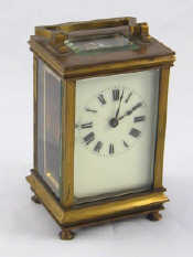 Appraisal: A brass carriage clock with white enamel dial and French