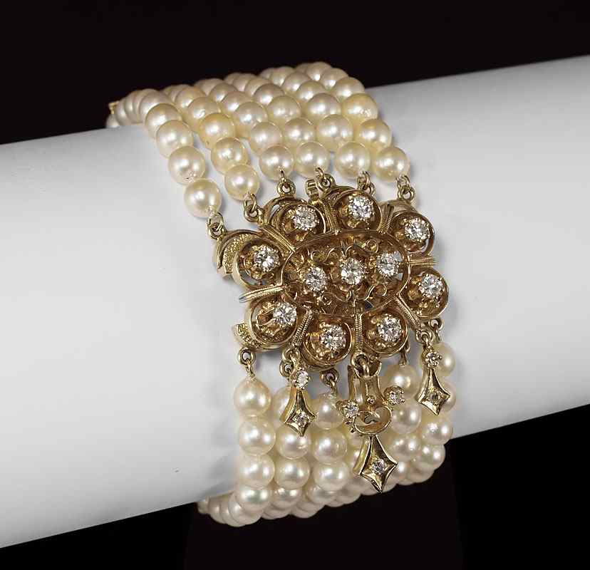 Appraisal: PEARL BRACELET WITH METAMORPHIC DIAMOND BROOCH Six strand cultured pearl