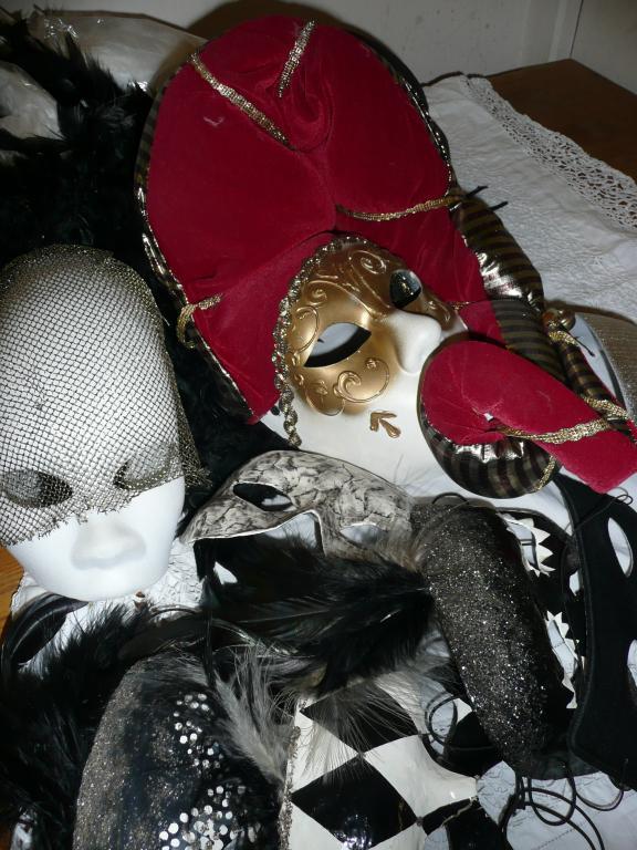 Appraisal: A group of theatrical masks feather boas and feather piece