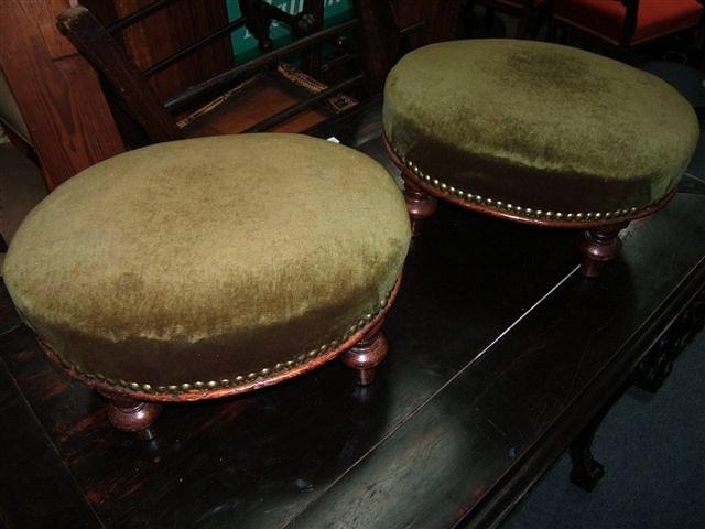 Appraisal: A pair of mahogany oval green upholstered foot stool a