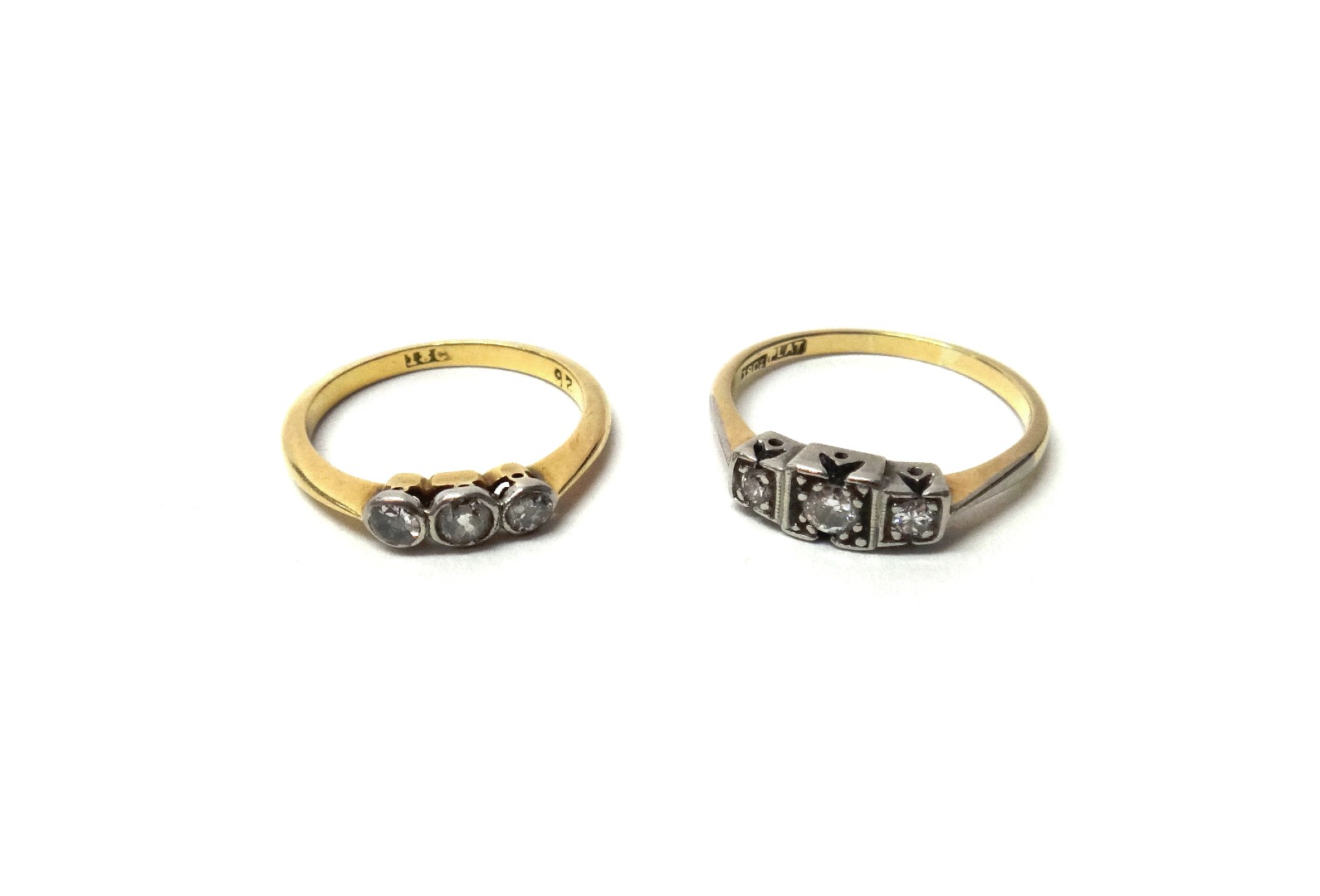 Appraisal: A gold and platinum diamond set three stone ring mounted