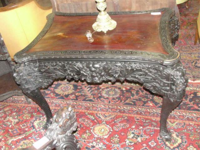 Appraisal: Highly Carved Asian Hardwood Center Table with Foo Lion Corners