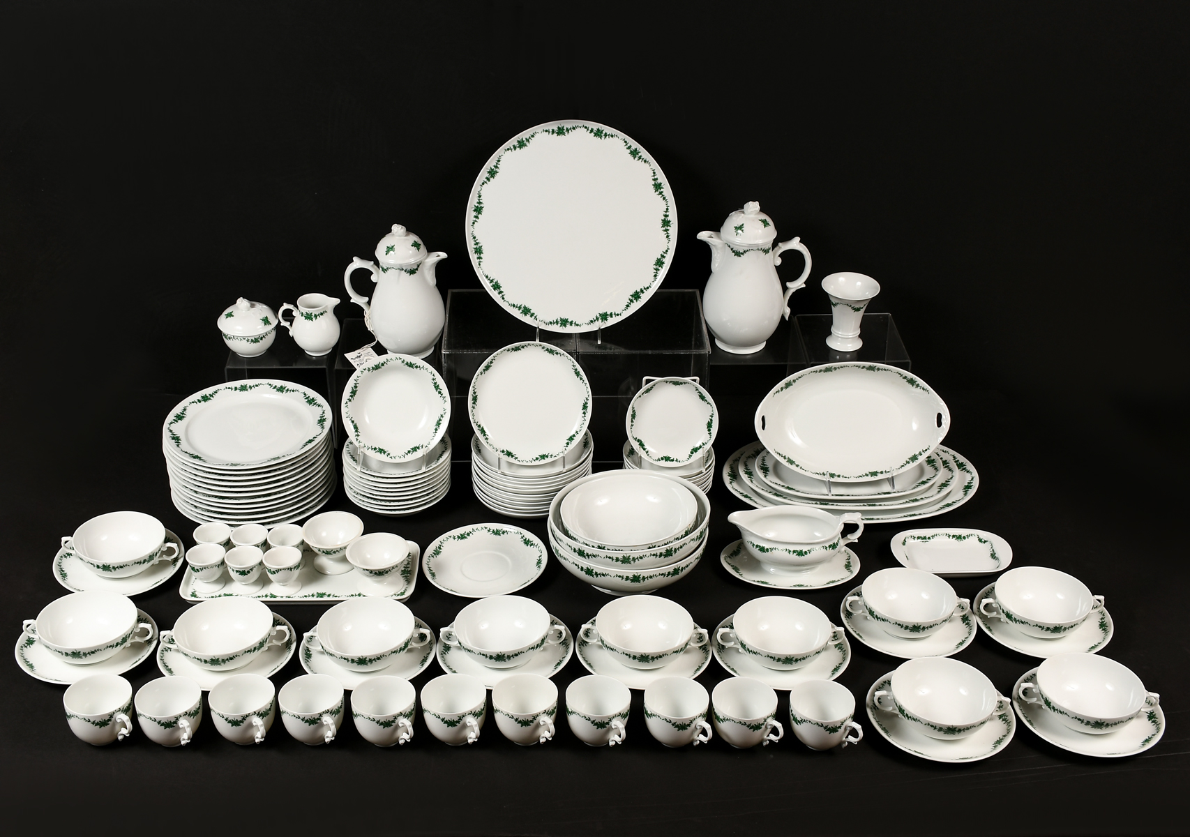 Appraisal: FURSTENBERG GERMAN CHINA SET WITH GREEN GARLAND Set includes -