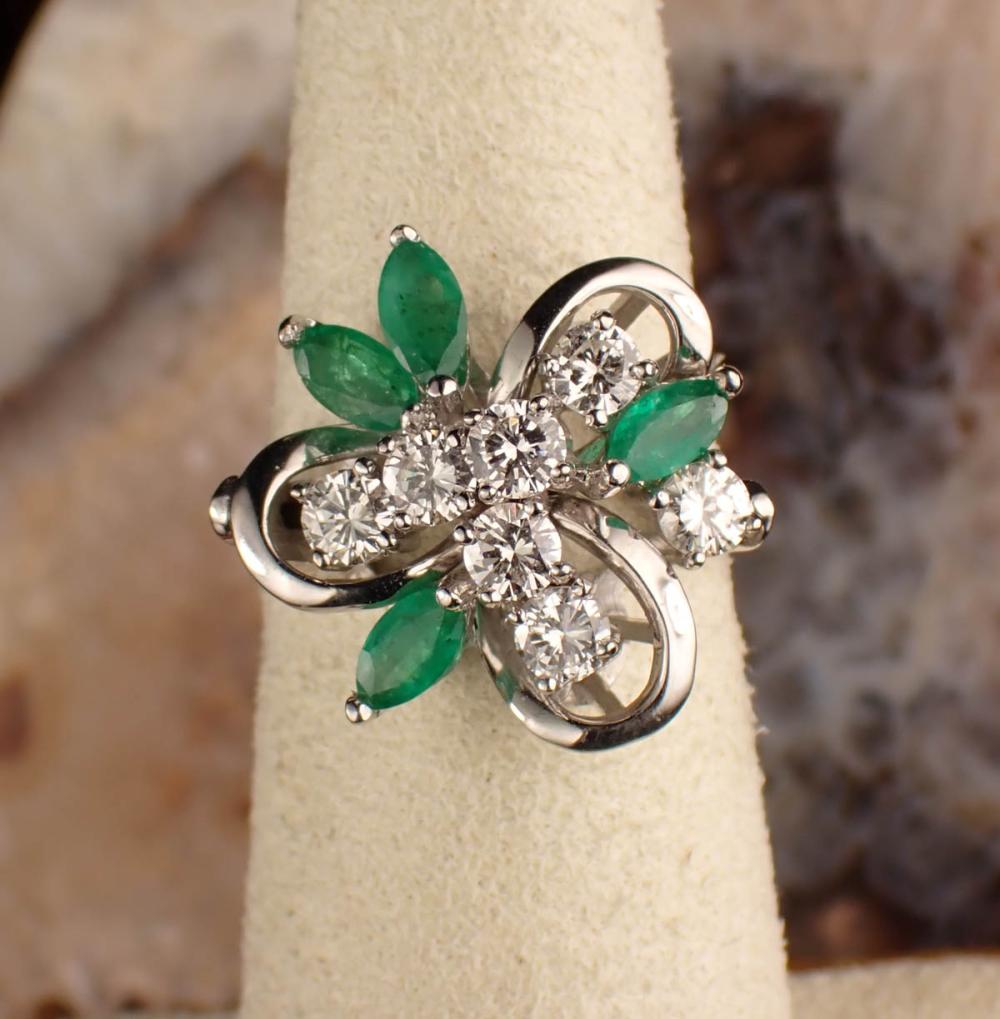 Appraisal: DIAMOND EMERALD AND FOURTEEN KARAT GOLD RING The white gold