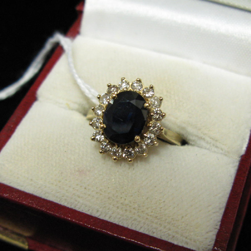 Appraisal: BLUE SAPPHIRE DIAMOND AND FOURTEEN KARAT GOLD RING set with