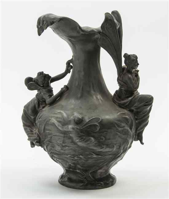 Appraisal: An Art Nouveau Pewter Figural Ewer decorated with fairies in