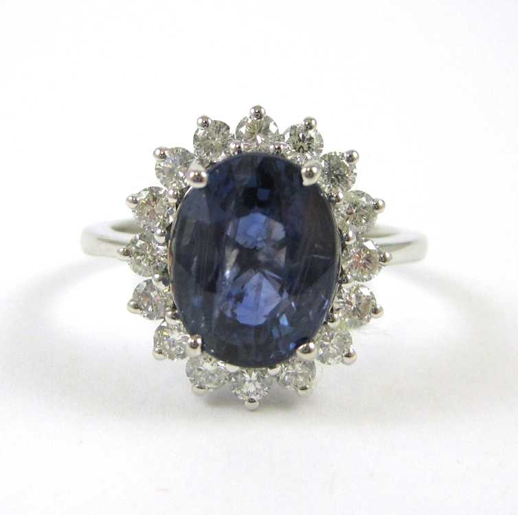 Appraisal: SAPPHIRE DIAMOND AND FOURTEEN KARAT WHITE GOLD RING with round-cut