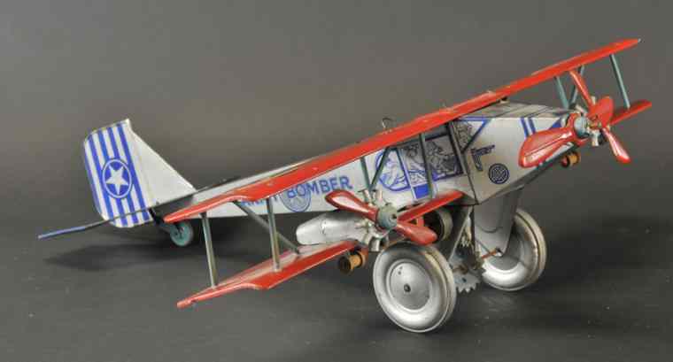 Appraisal: MARX ARMY BOMBER c lithographed tin silver body with red