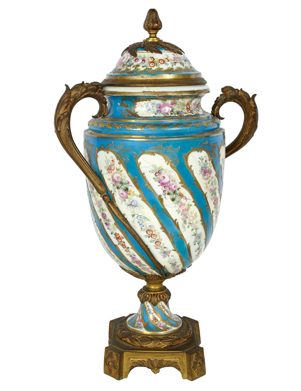 Appraisal: SEVRES-STYLE PORCELAIN COVERED URNSevres-style interlaced L mark with gilt metal