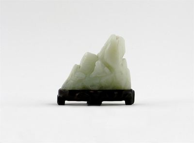 Appraisal: A Chinese jade carving of Shoulao sitting holding a peach