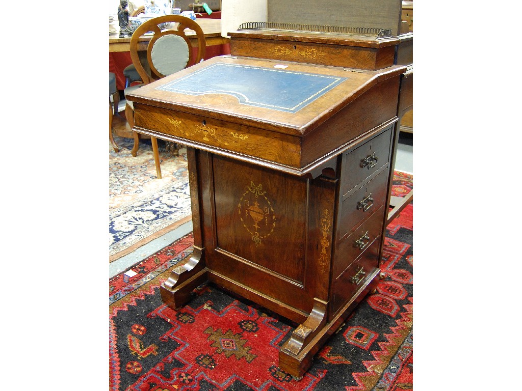 Appraisal: A late Victorian inlaid rosewood davenport in the Sheraton style