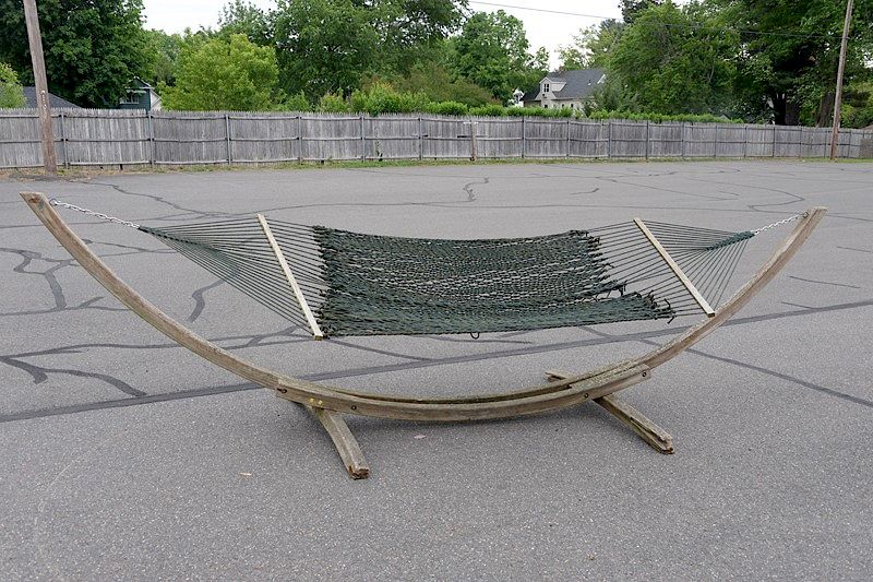 Appraisal: Roman Arts teak and rope hammock Roman Arts teak and