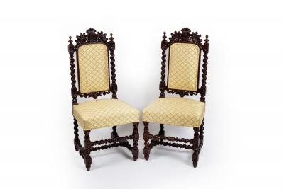 Appraisal: A pair of th Century carved oak hall chairs with