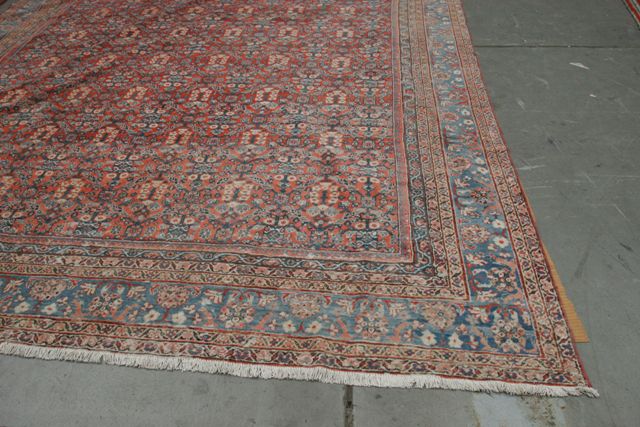 Appraisal: A large Iranian carpet in Faraghan style the central panel