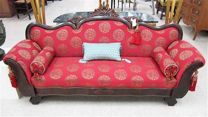 Appraisal: EMPIRE VICTORIAN TRANSITIONAL MAHOGANY SOFA American c having a serpentine-arch