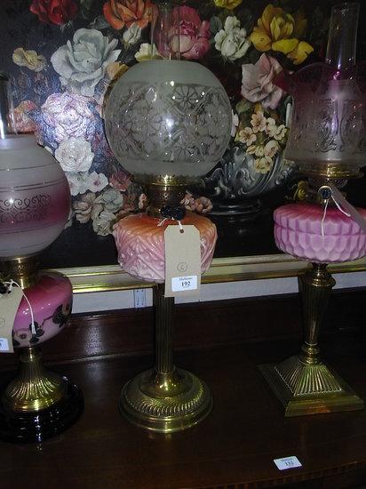 Appraisal: AN OIL LAMP with floral glass globe shade floral moulded