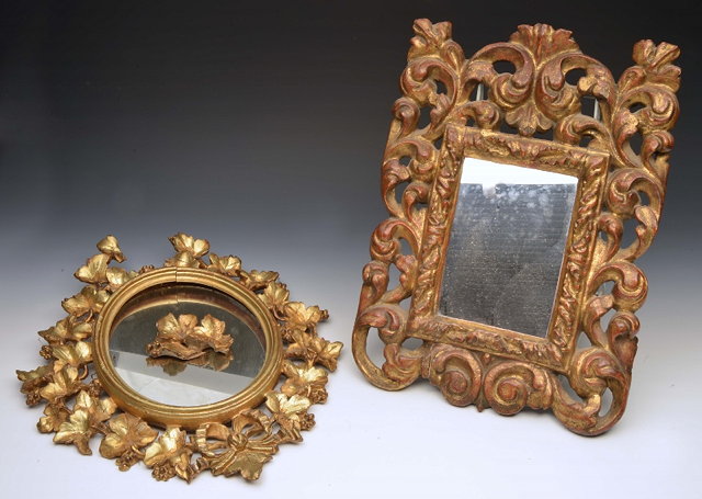 Appraisal: AN ANTIQUE VENETIAN CARVED GILTWOOD HANGING WALL MIRROR of open