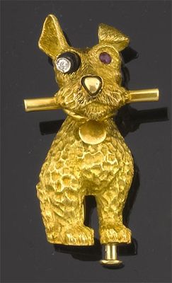 Appraisal: A gold dog brooch by Cartier The sitting dog holding