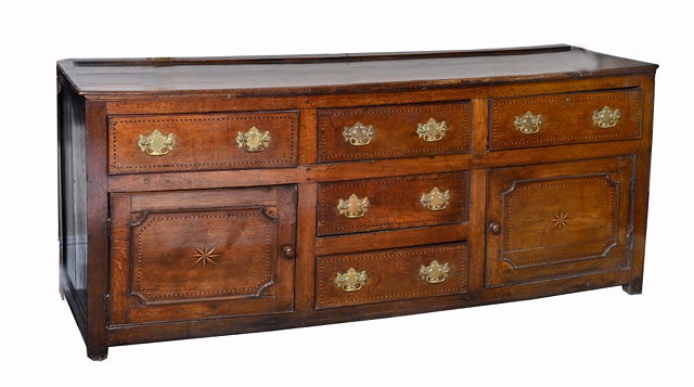 Appraisal: A GEORGIAN OAK DRESSER BASE with five short drawers and