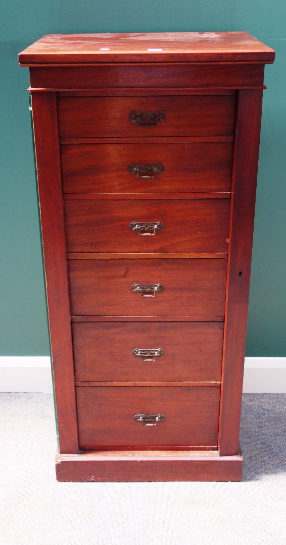 Appraisal: A late Victorian mahogany Wellington chest the six graduated drawers