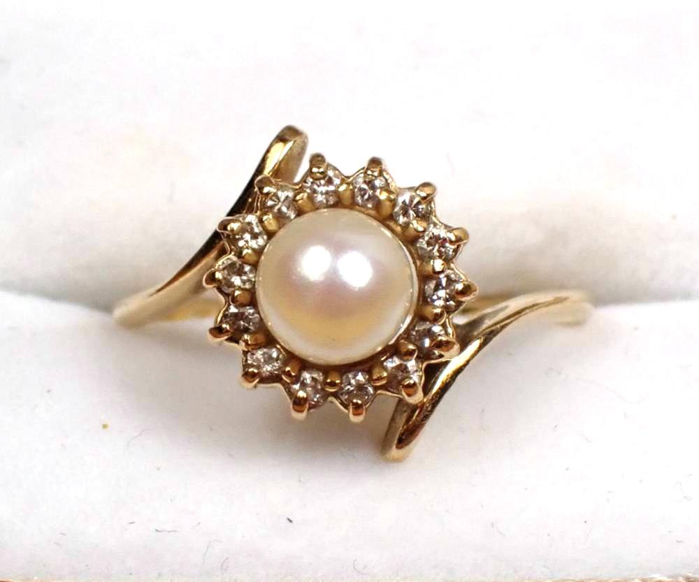 Appraisal: PEARL DIAMOND AND FOURTEEN KARAT GOLD RING with round-cut diamonds