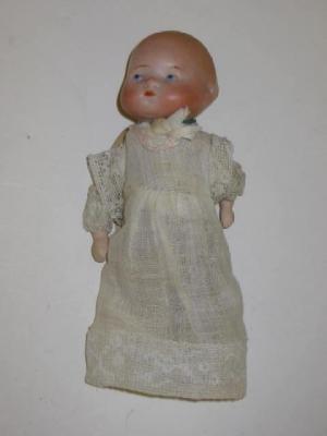 Appraisal: An Armand Marseille bisque head bottle baby with moulded face