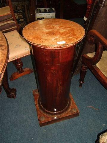 Appraisal: A th Century mahogany pedestal of simple column form on