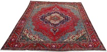 Appraisal: A Tabriz Carpet This carpet features bold color palette and