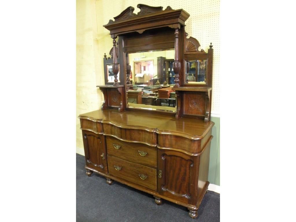 Appraisal: A Victorian mahogany sideboard the later mirror back with three