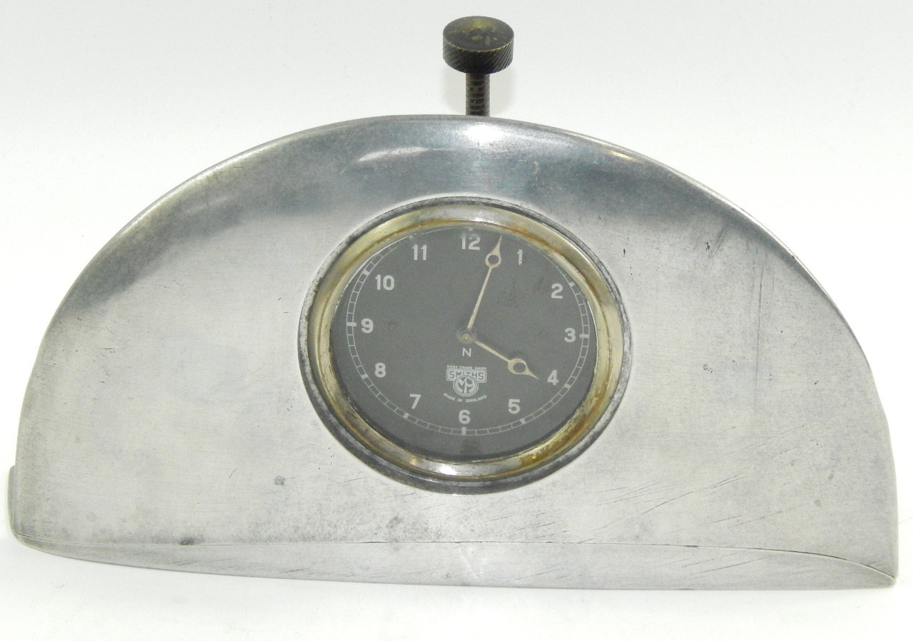 Appraisal: A Smith's dashboard clock fitted in an aluminium frame cm