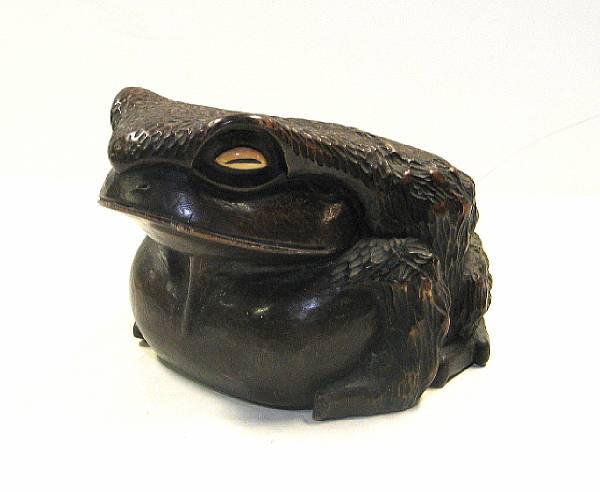 Appraisal: A large carved wood okimono of a toad Taisho Showa