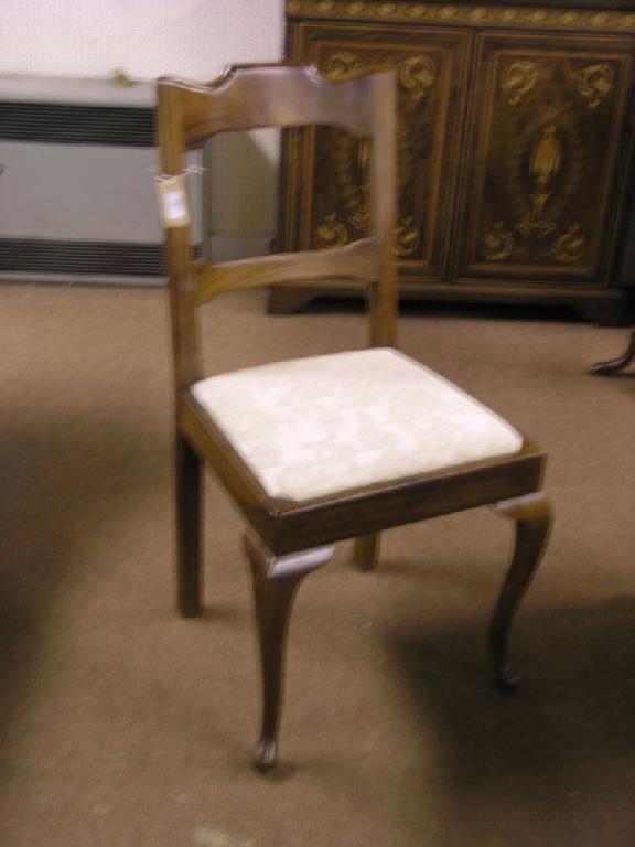 Appraisal: A pair of colonial rosewood dining chairs with rail backs