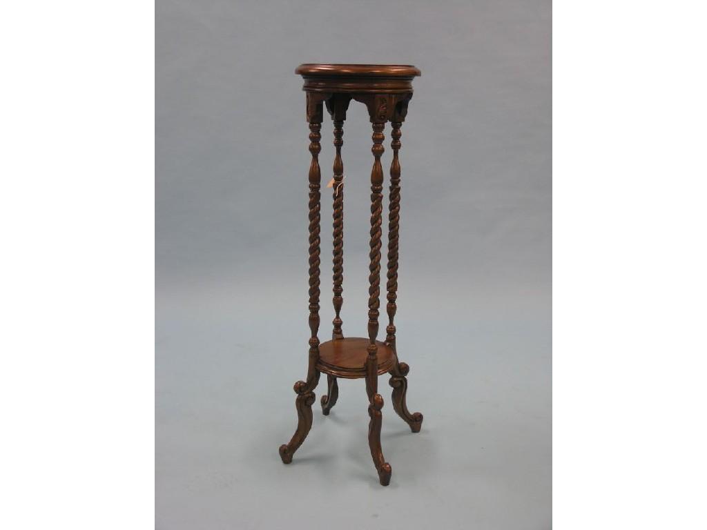 Appraisal: A reproduction mahogany jardiniere stand circular-shape on four barley-twist supports