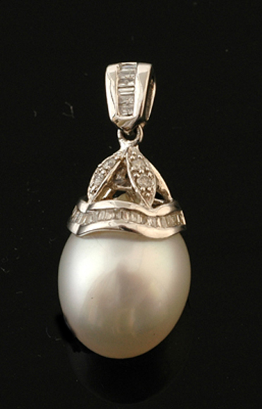 Appraisal: A South Sea pearl and diamond pendant The tear drop