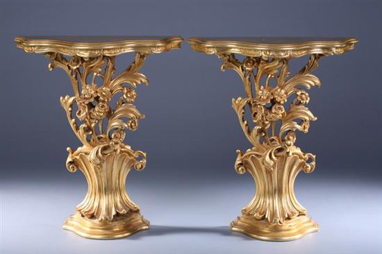 Appraisal: PAIR ROCOCO STYLE GILTWOOD PETITE CONSOLES late th century Serpentine