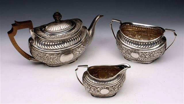 Appraisal: A VICTORIAN THREE PIECE TEA SET bulbous shaped tea pot