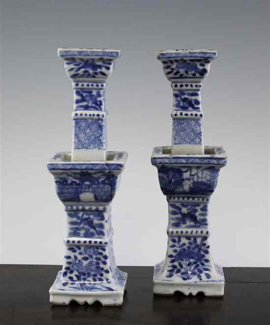 Appraisal: A pair of Chinese blue and white altar style candlesticks