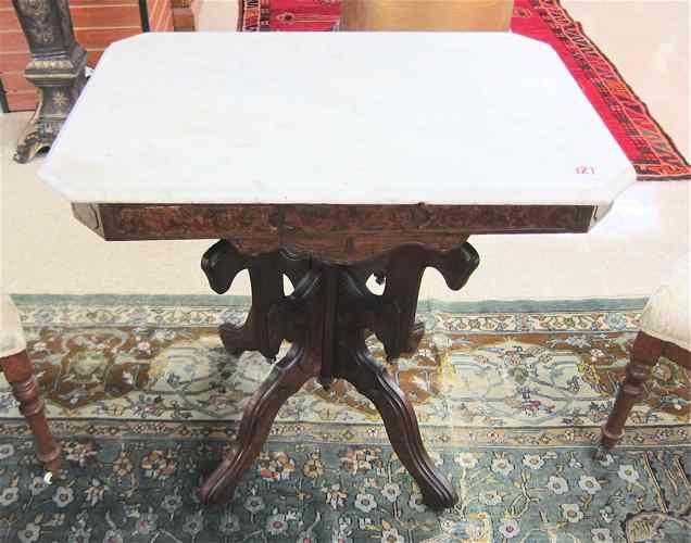 Appraisal: A VICTORIAN MARBLE-TOPPED WALNUT LAMP TABLE American last quarter of