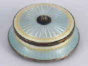 Appraisal: A silver guilloche enamelled circular pale blue and white table