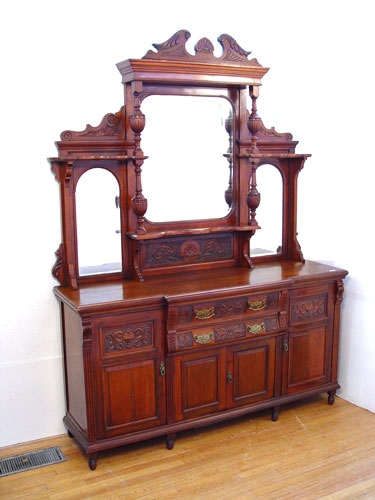 Appraisal: ENGLISH WALNUT MIRROR BACK SIDEBOARD CA Carved pediment top three