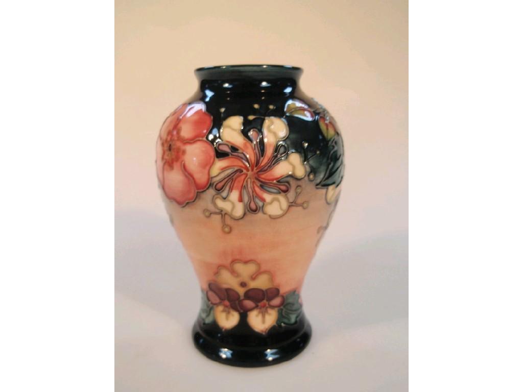 Appraisal: A Moorcroft pottery Oberon pattern baluster vase tube lined and