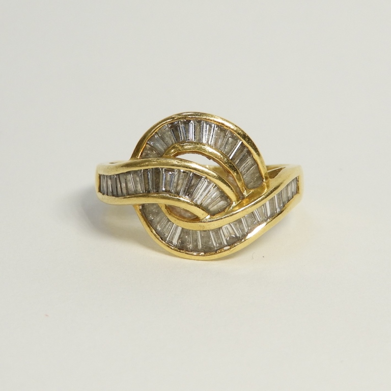 Appraisal: VINTAGE K GOLD DIAMOND BAGUETTE COCKTAIL RING th CenturySwirling array