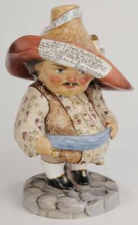 Appraisal: Auctioneer Figurine porcelain painted figure wearing hat with auction listing