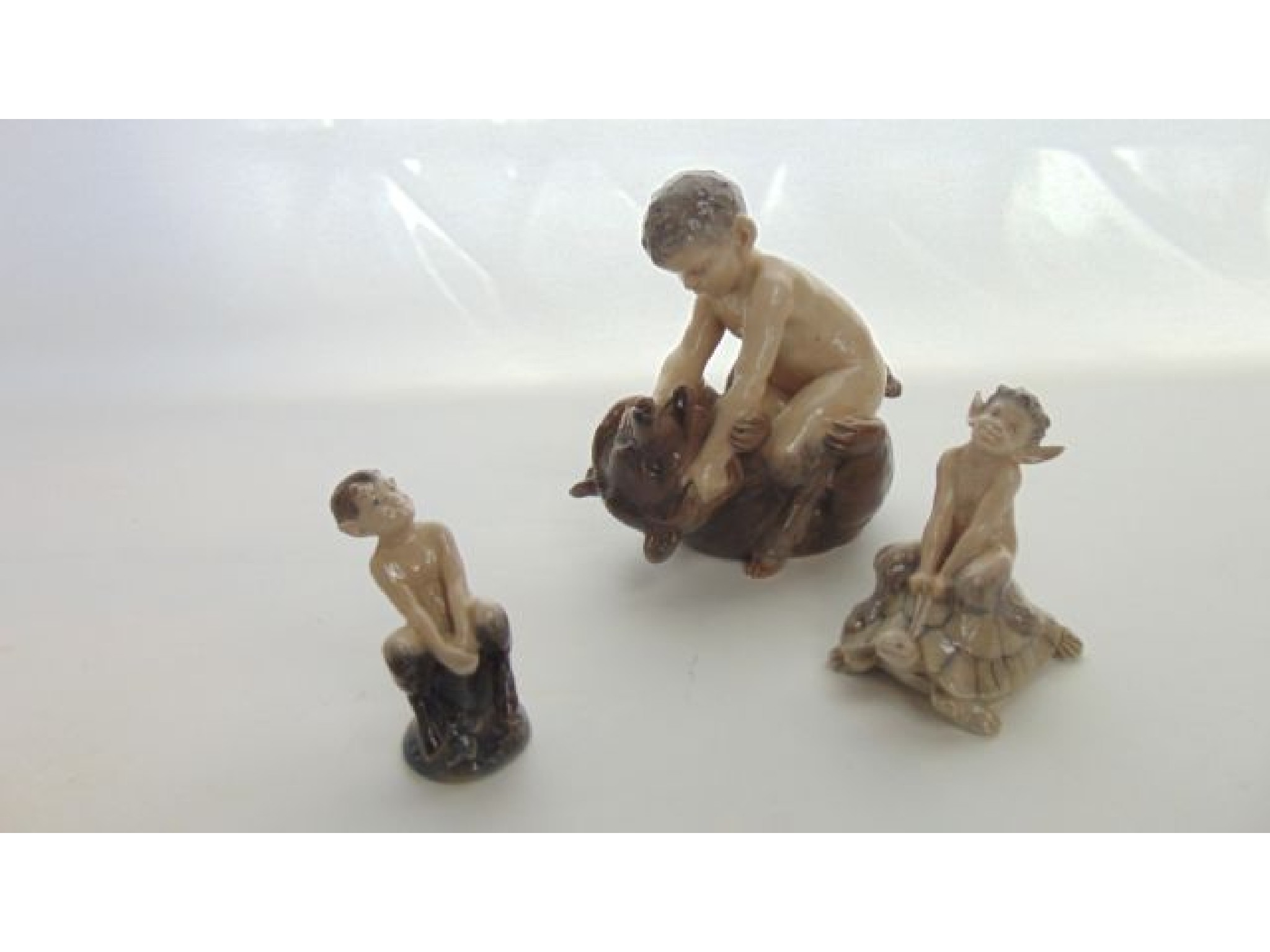 Appraisal: A Royal Copenhagen model of a faun wrestling a bear