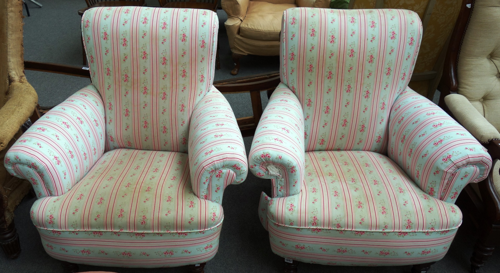 Appraisal: A pair of late th century easy armchairs on stained