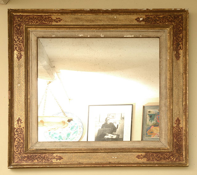 Appraisal: A RECTANGULAR WALL MIRROR within a gilt and painted frame