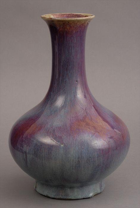 Appraisal: CHINESE FLAMB -GLAZED PORCELAIN PEAR-FORM VASE The flattened ovoid bowl